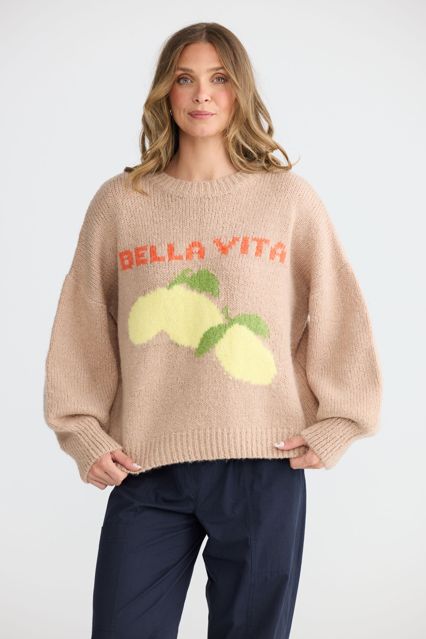 Model wearing Bella Vita Knit Oatmeal with oversized relaxed fit, alternate view on white background