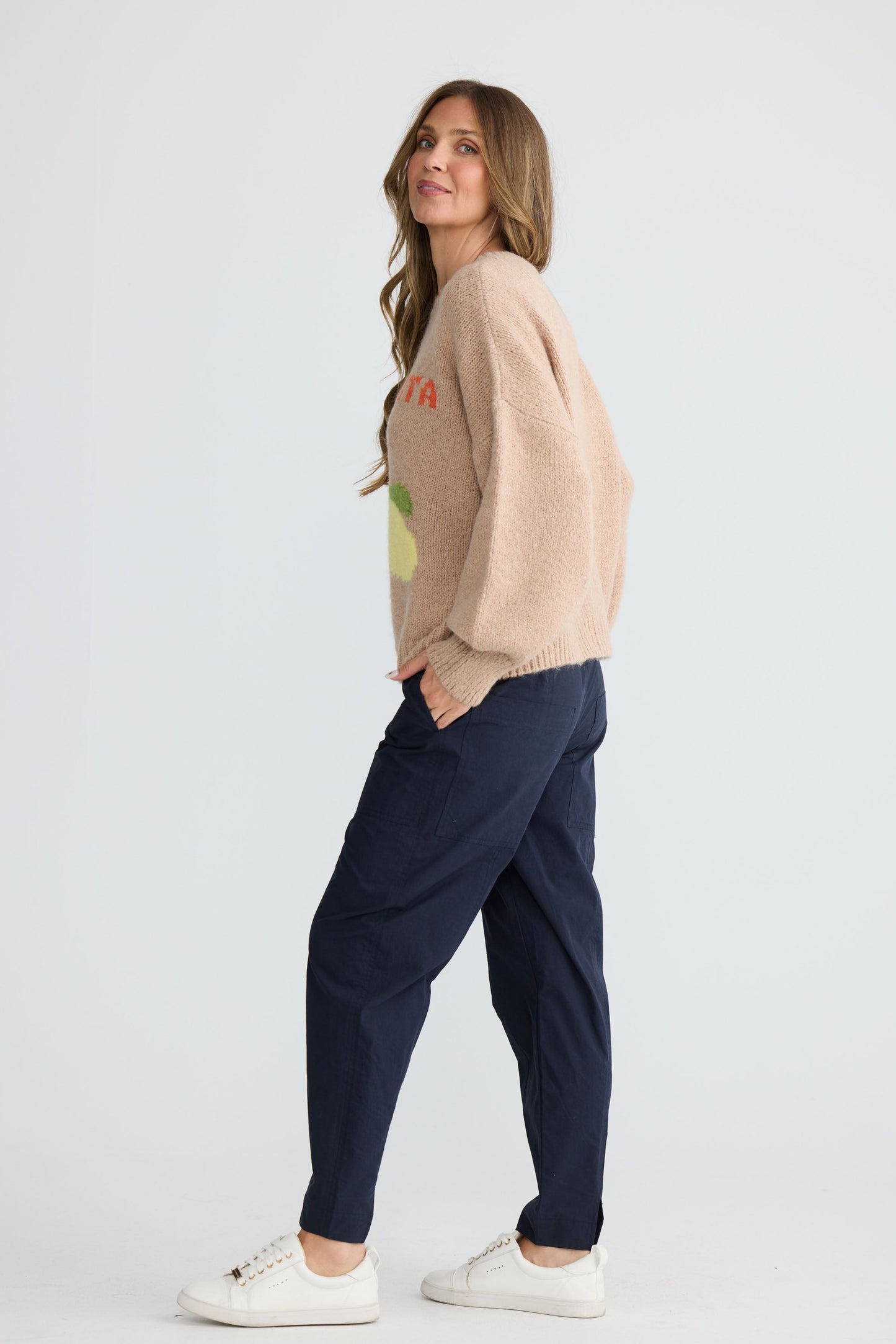 Model wearing Bella Vita Knit Oatmeal with oversized relaxed fit, detail view on white background