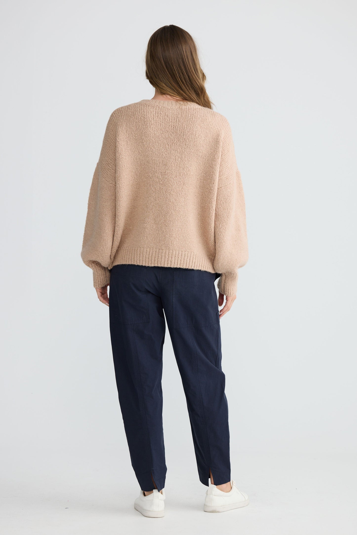 Model wearing Bella Vita Knit Oatmeal with oversized relaxed fit, front view on white background