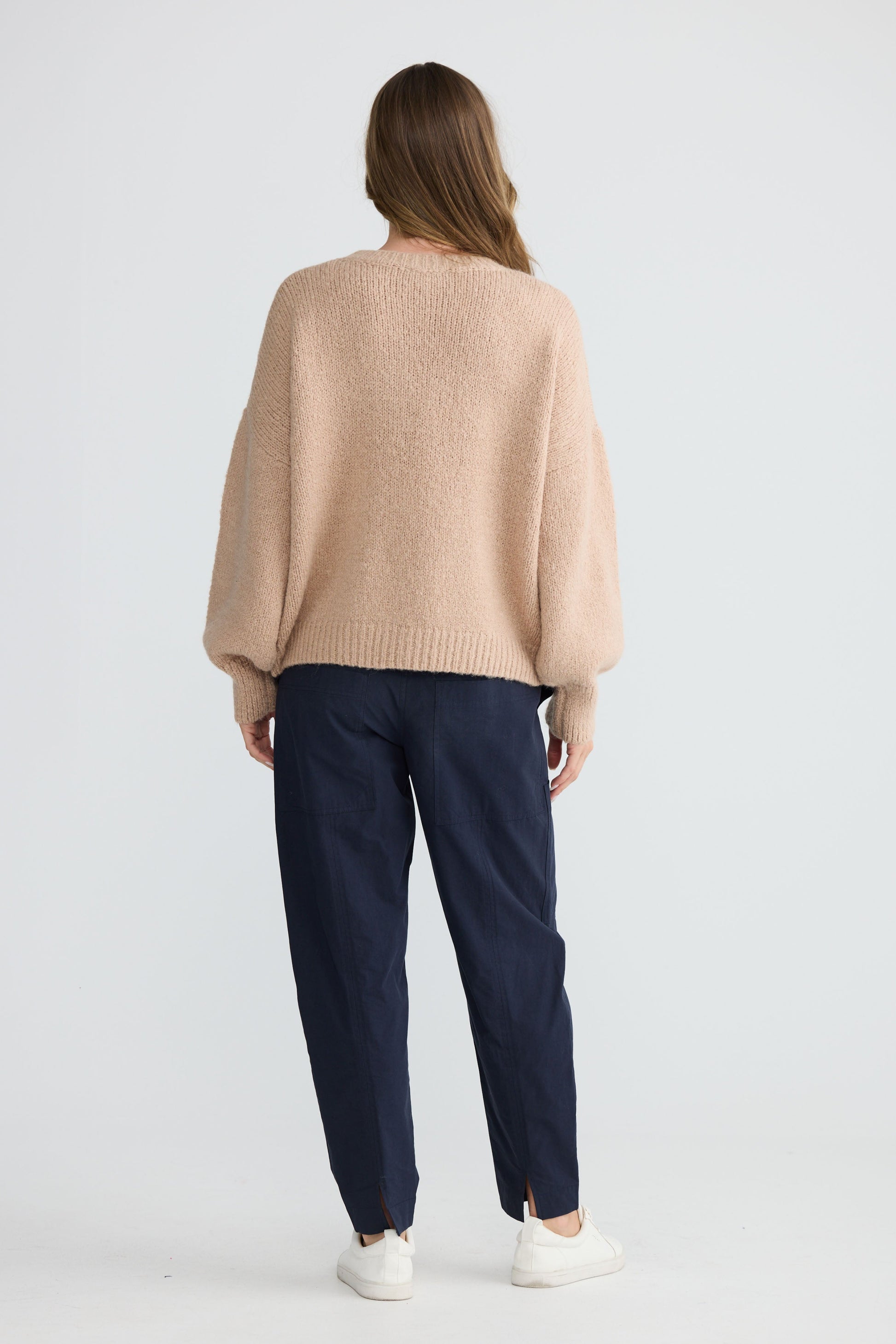 Model wearing Bella Vita Knit Oatmeal with oversized relaxed fit, front view on white background