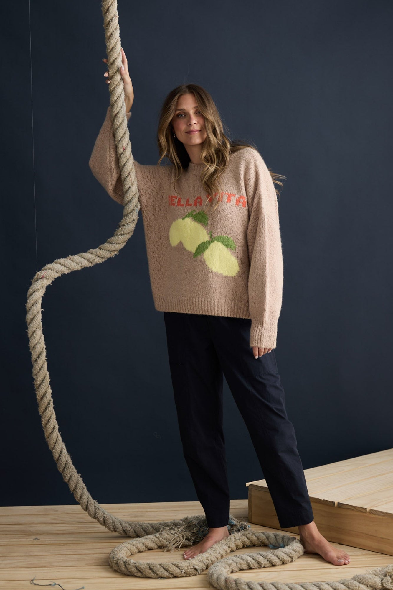 Model wearing Bella Vita Knit Oatmeal with oversized relaxed fit, campaign lifestyle view