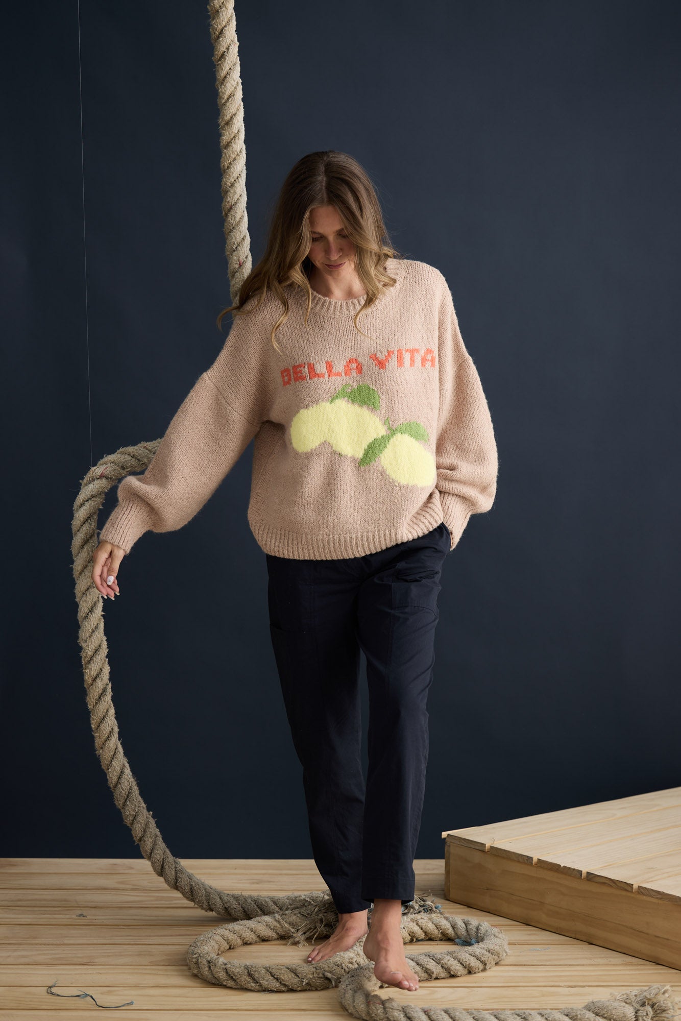 Model wearing Bella Vita Knit Oatmeal with oversized relaxed fit, campaign lifestyle view