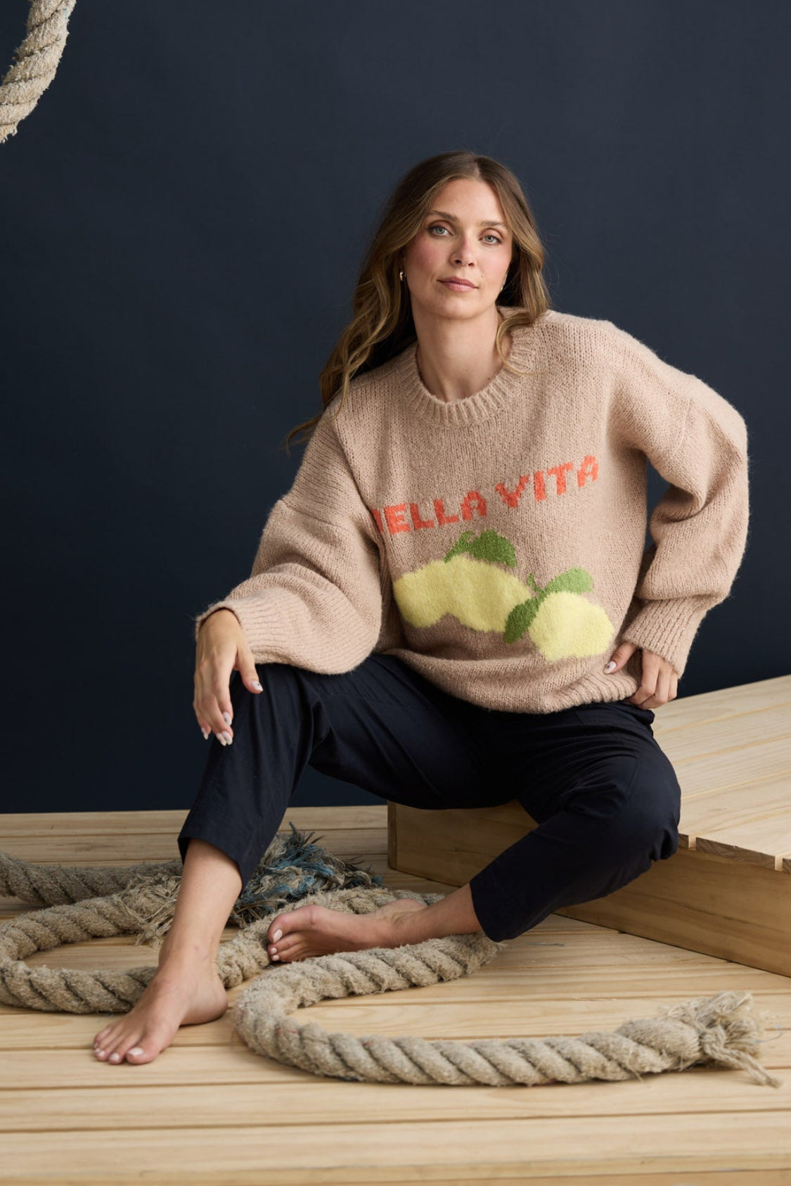 Model wearing Bella Vita Knit Oatmeal with oversized relaxed fit, campaign lifestyle view