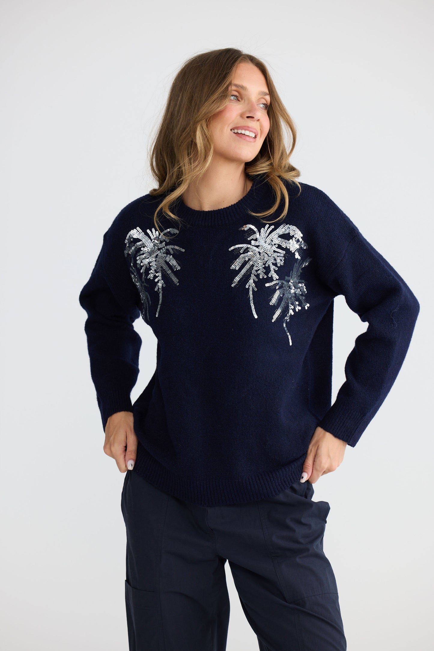 Model wearing Paradise Knit Navy with dropped shoulder and relaxed fit, alternate view on white background