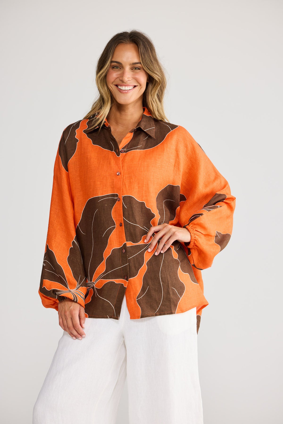 Cliffside Shirt in Hibiscus Breeze with exaggerated grown on sleeve and elasticated cuffs.