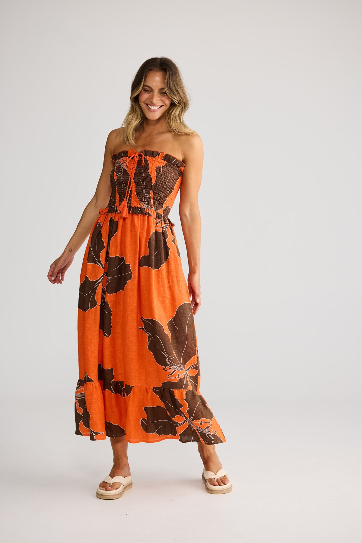 Sorrel Dress in Hibiscus Breeze with frill at neckline and waist seam.