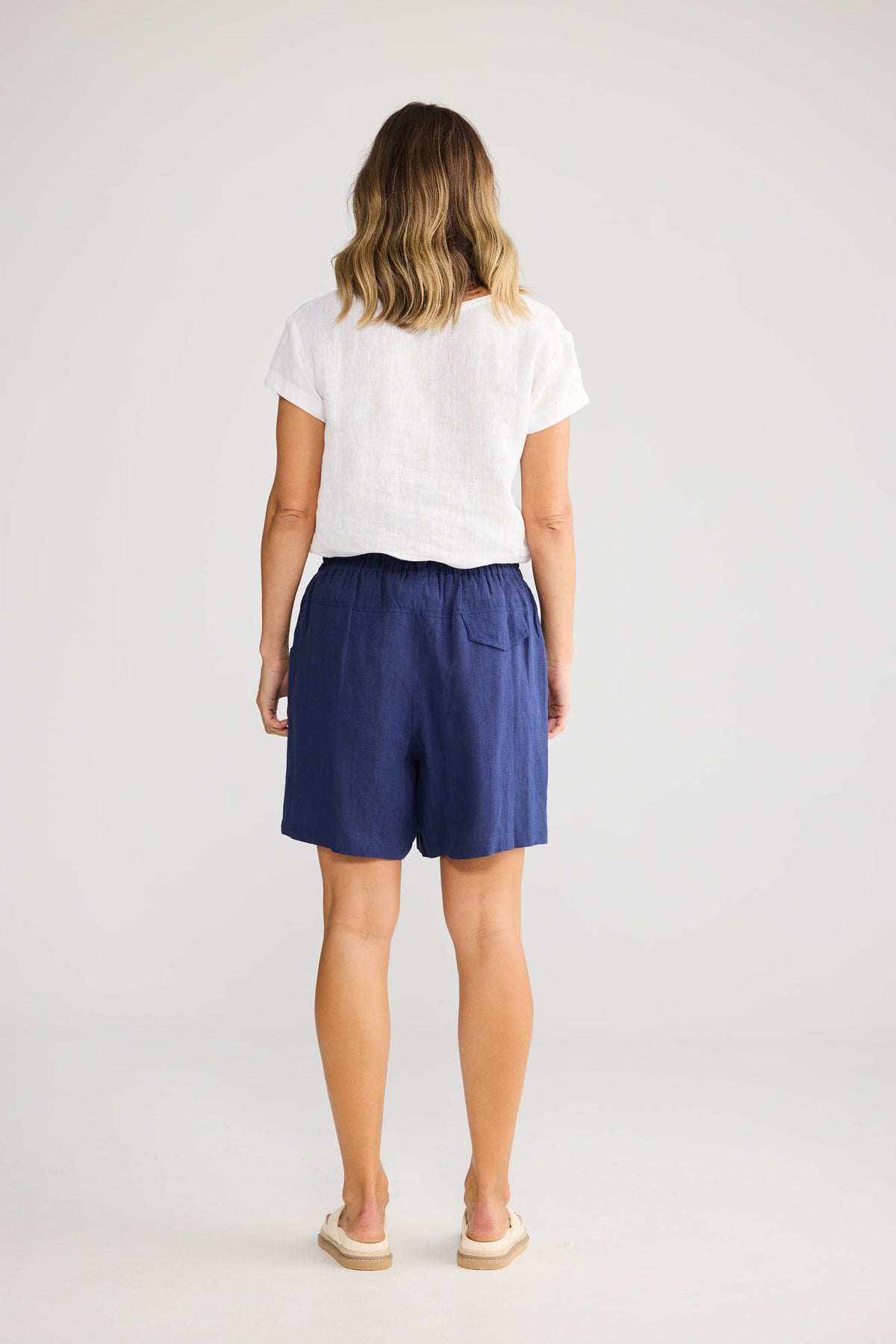 Captain Short in Navy with cut away pockets.