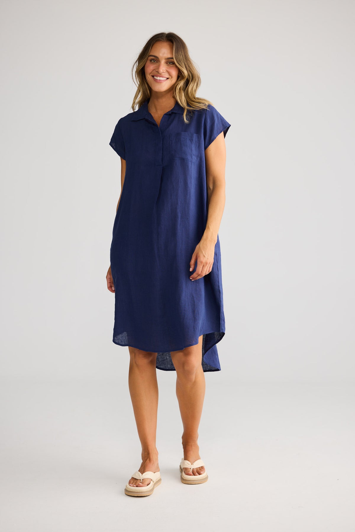 Model wearing Ahoy Tunic in navy, front view. Same silhouette as natural linen colourway.