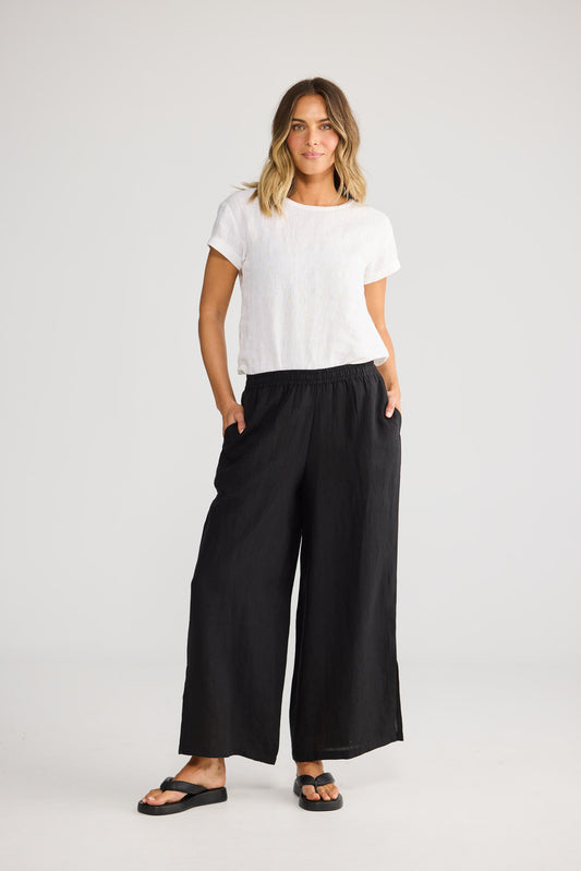Fly Away Pant in Black with full length.