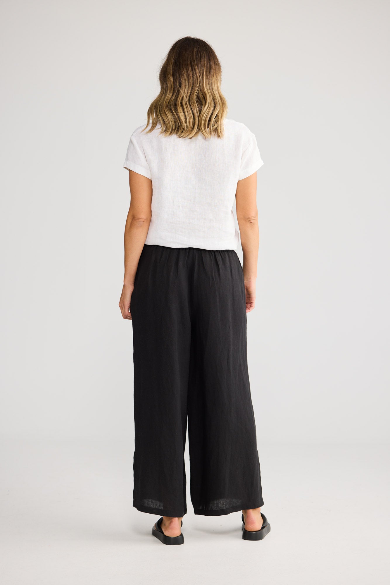 Fly Away Pant in Black with relaxed wide leg.
