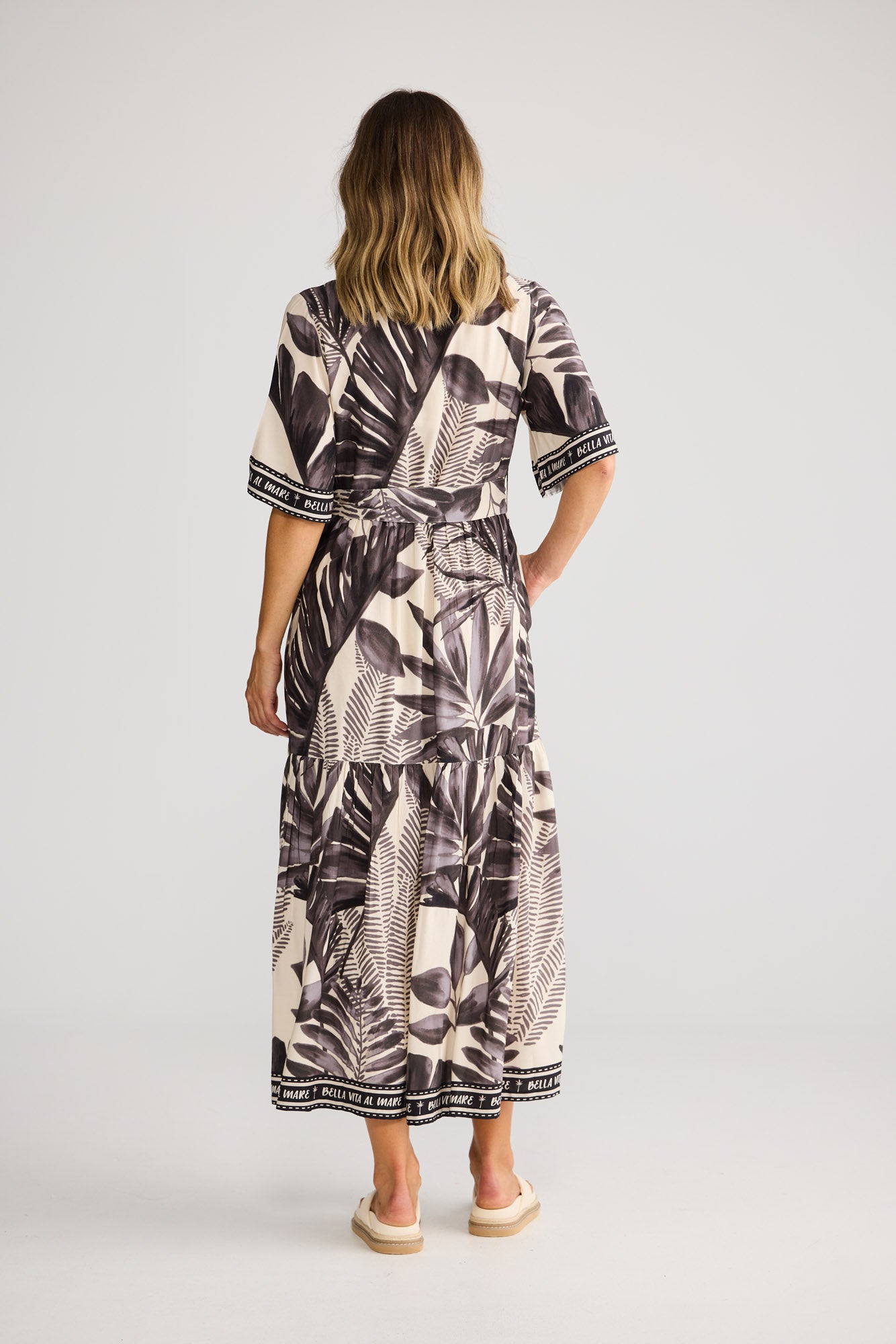 Lynwood Dress in Sunset Palm with short sleeves.
