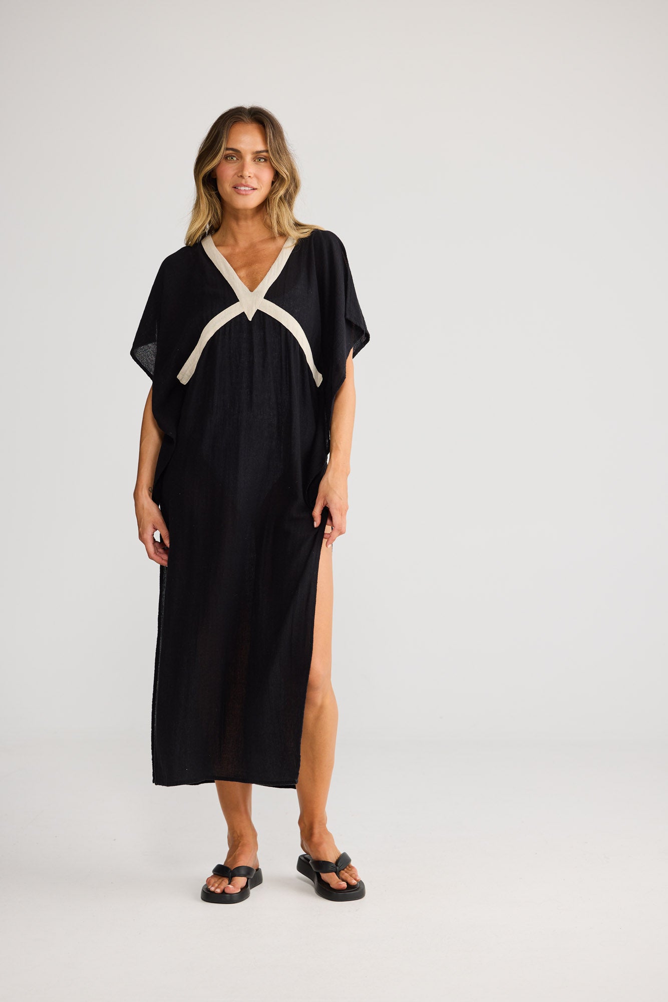Luma Kaftan in Black with Natural, featuring shoulder splits.