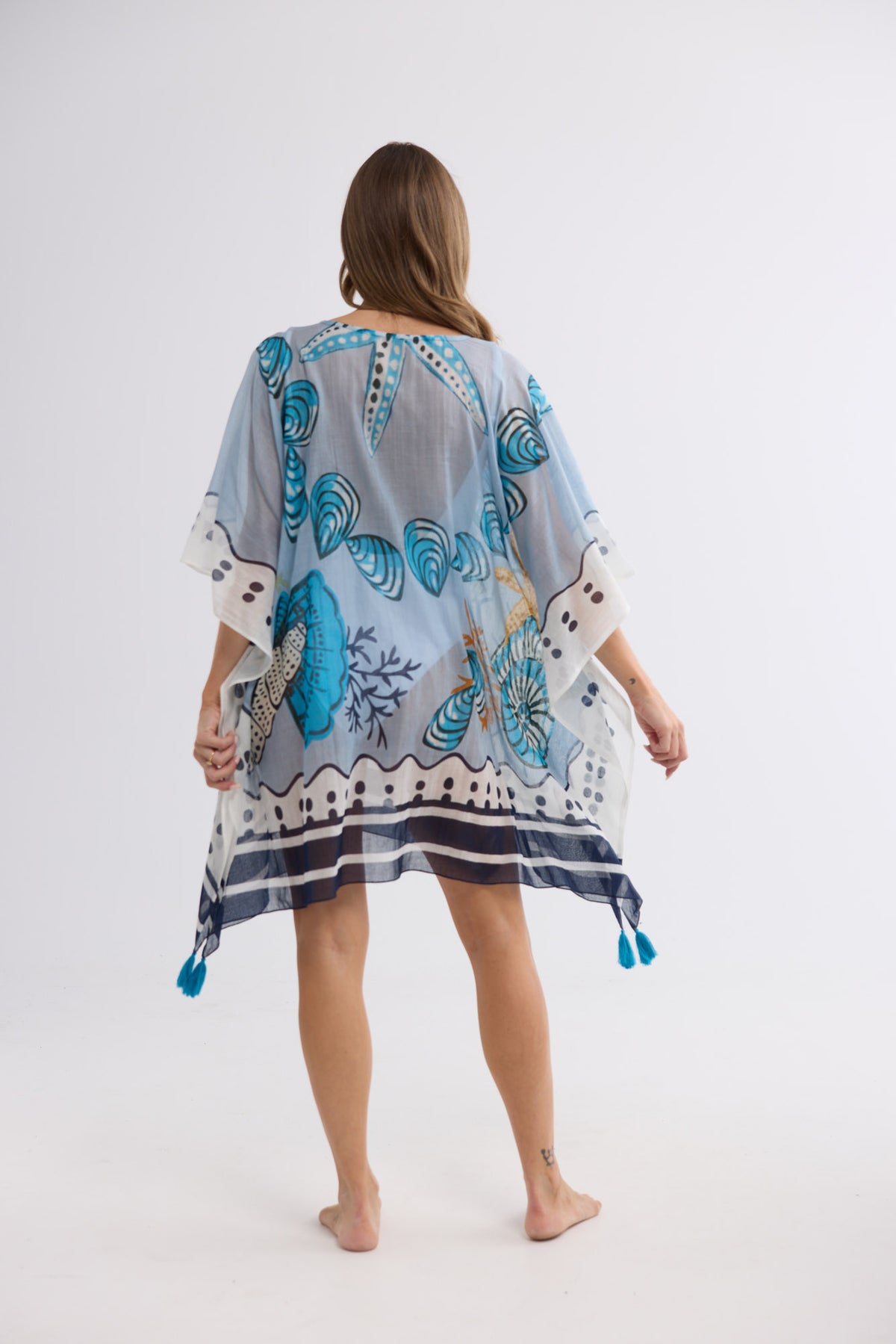 Stella Kaftan in Starfish Dreams with a flowy silhouette.