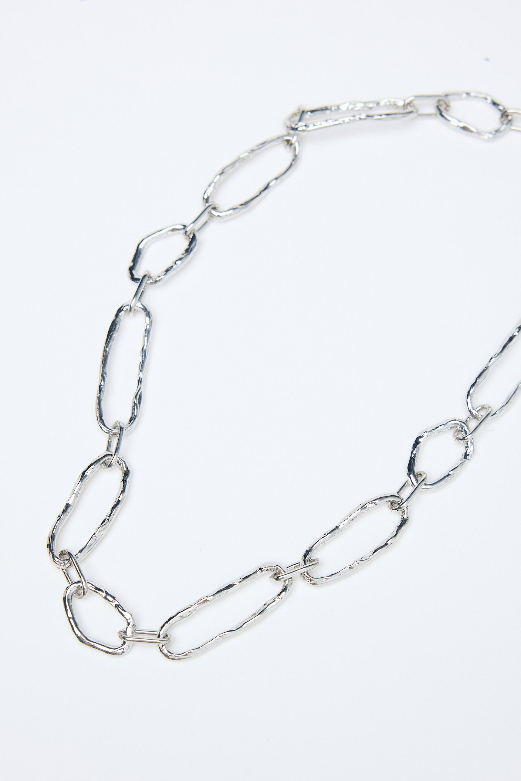 Silver chain necklace on a white background