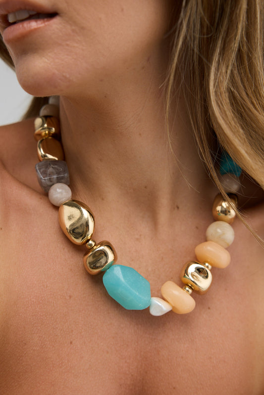 Necklace with colorful beads worn by a person