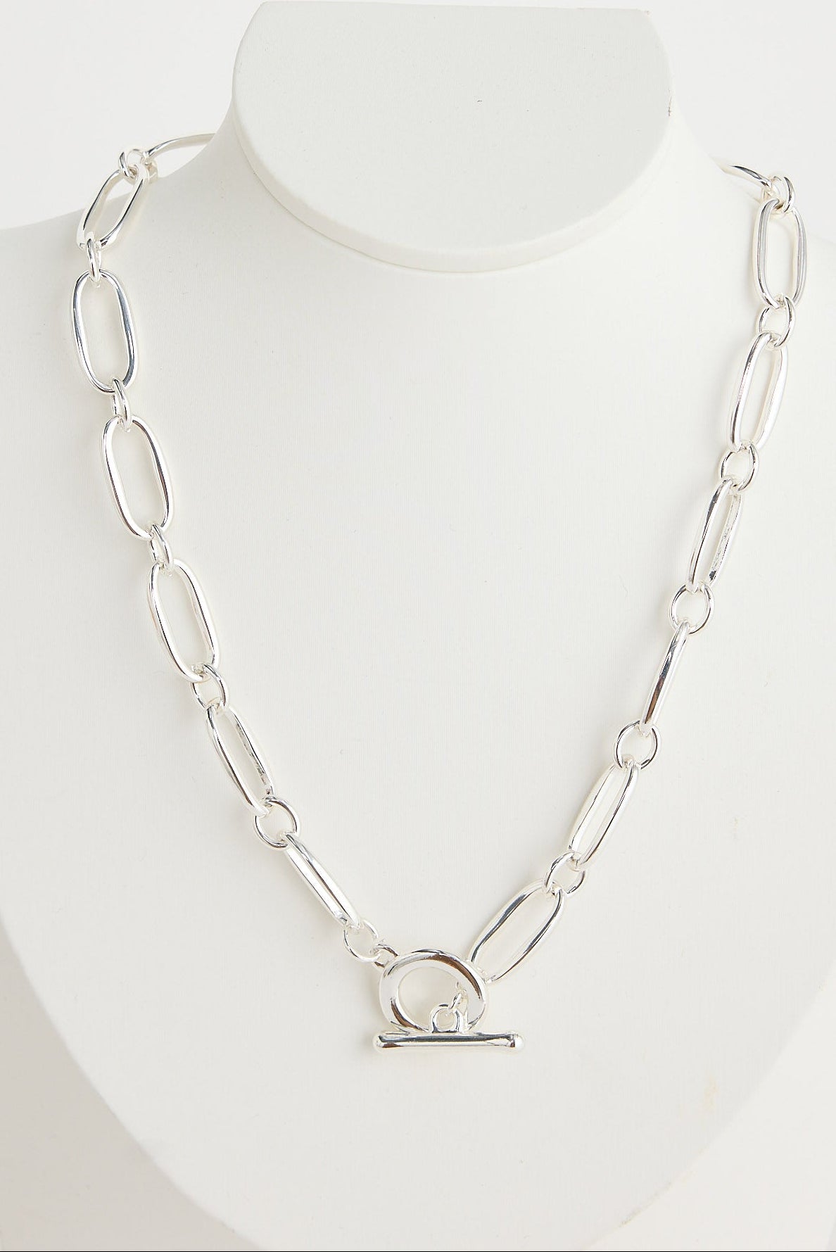 Silver chain necklace on a mannequin with a white background