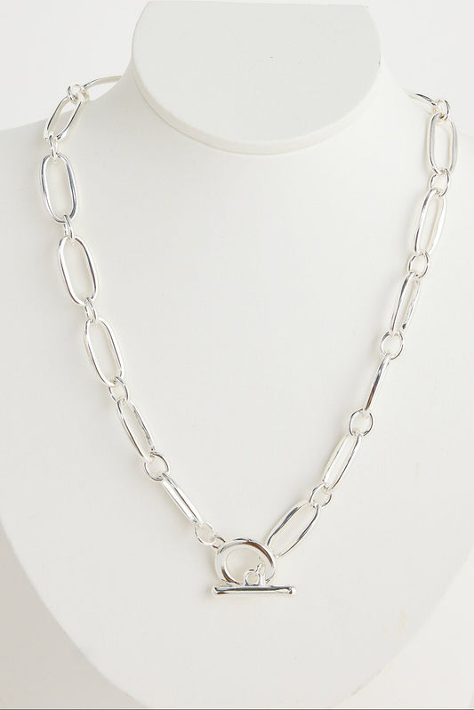 Silver chain necklace on a mannequin with a white background