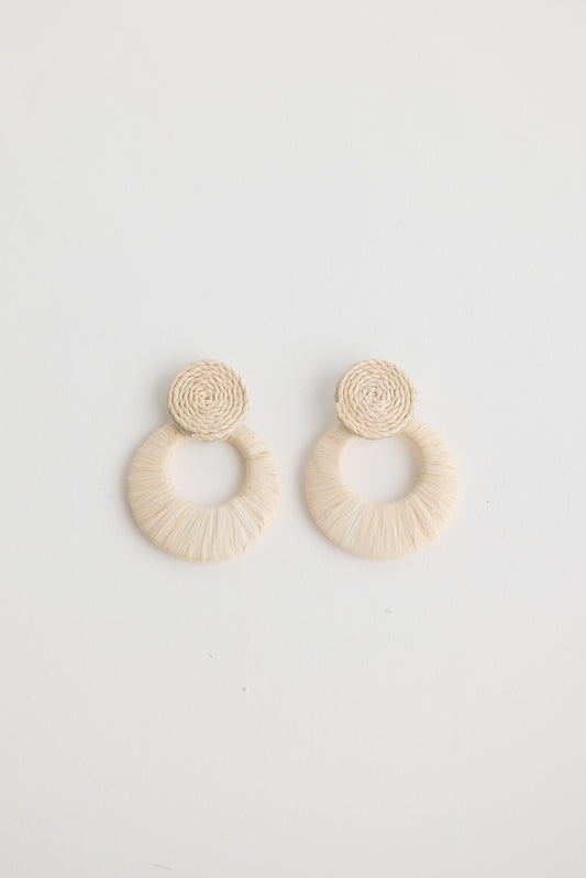 Close-up of natural eloise earrings earrings on white background.