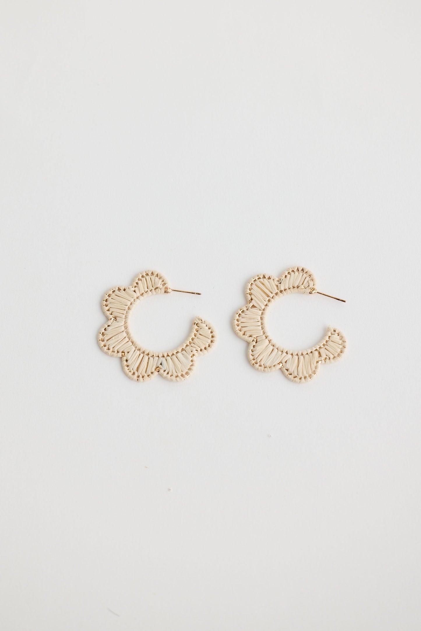 Close-up of natural hannah earrings earrings on white background.
