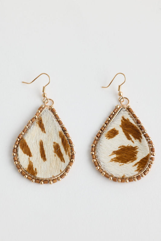Teardrop-shaped earrings with brown and white pattern on a light gray background