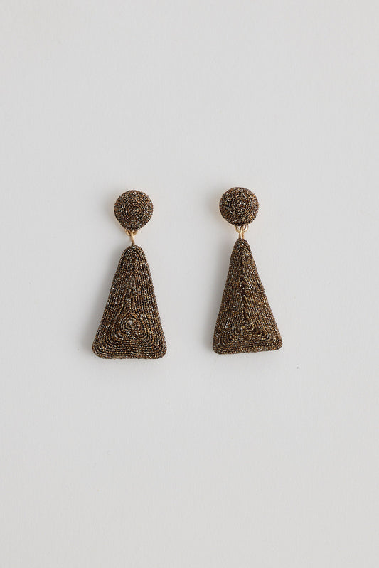 Pair of bronze earrings on a light gray background