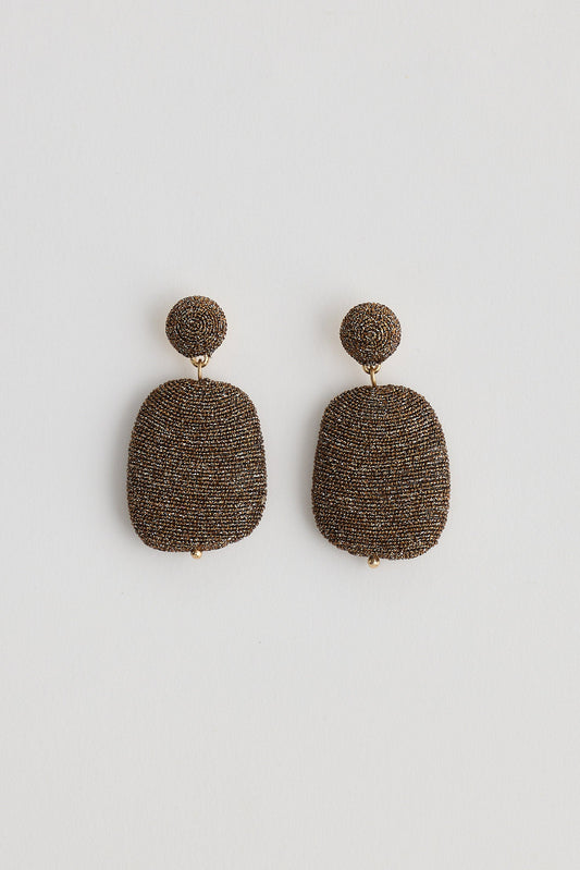 Pair of textured earrings on a white background