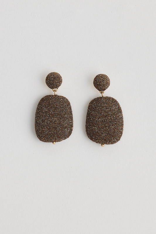 Pair of textured earrings on a white background