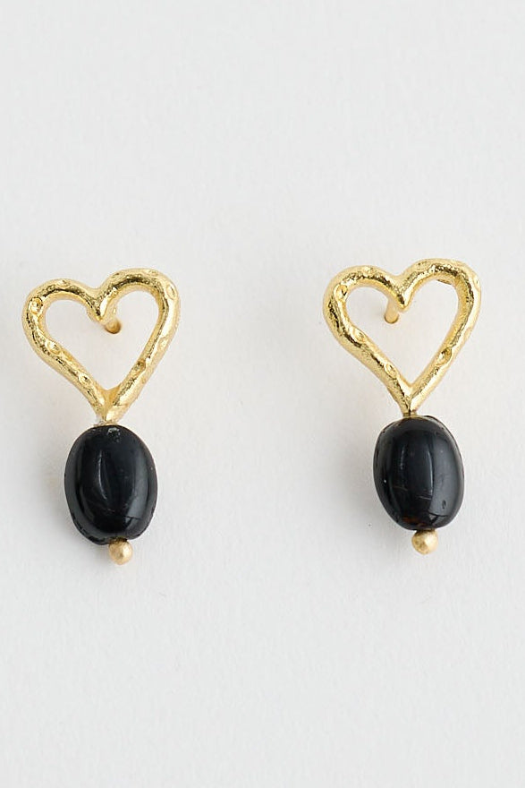 Close-up of black bengali earrings earrings on white background.
