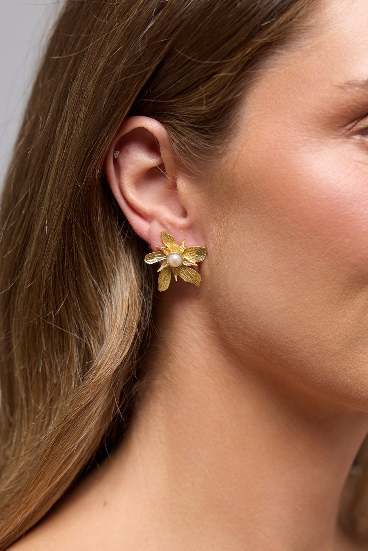 Malar Earrings in gold, front view.