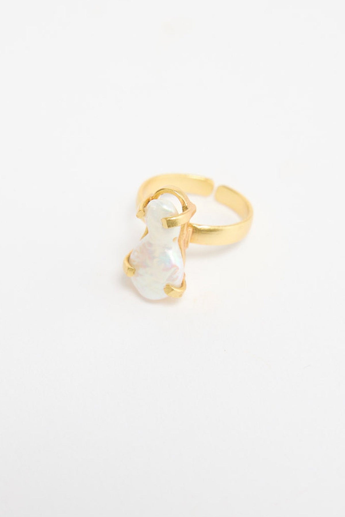 Gold-tone adjustable ring with a large oval freshwater pearl stone set in a hammered open-frame bezel, shown at an angle on a white background