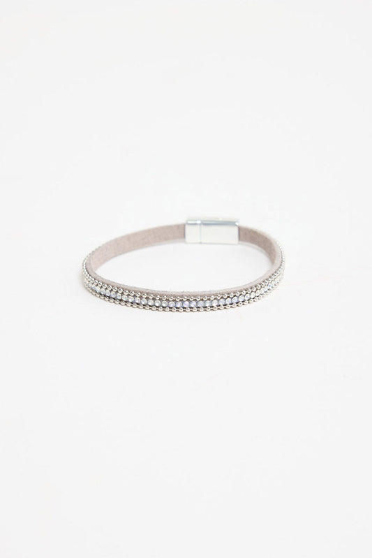 Harper Bracelet in silver-tone finish, showing the grey suede band, row of clear crystals, ball-chain trim and magnetic clasp