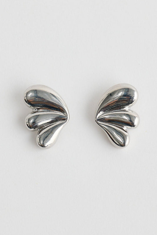 Close-up of silver taylor earrings earrings on white background.