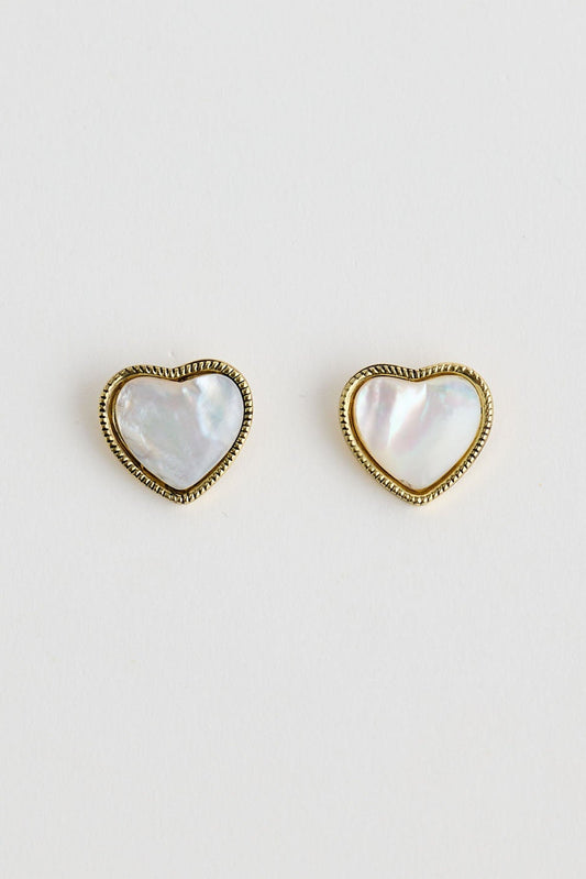 Close-up of white finley earrings earrings on white background.