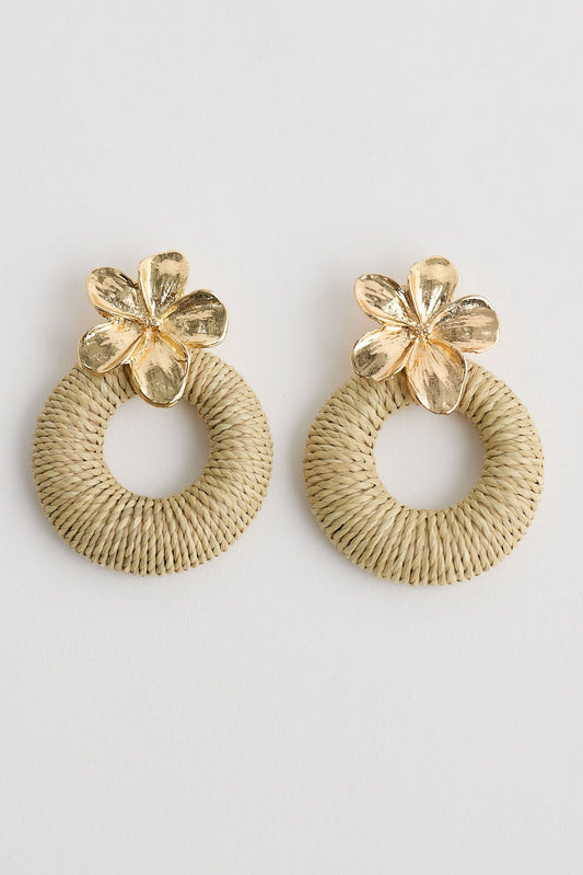 Close-up of natural frangipani earrings earrings on white background.