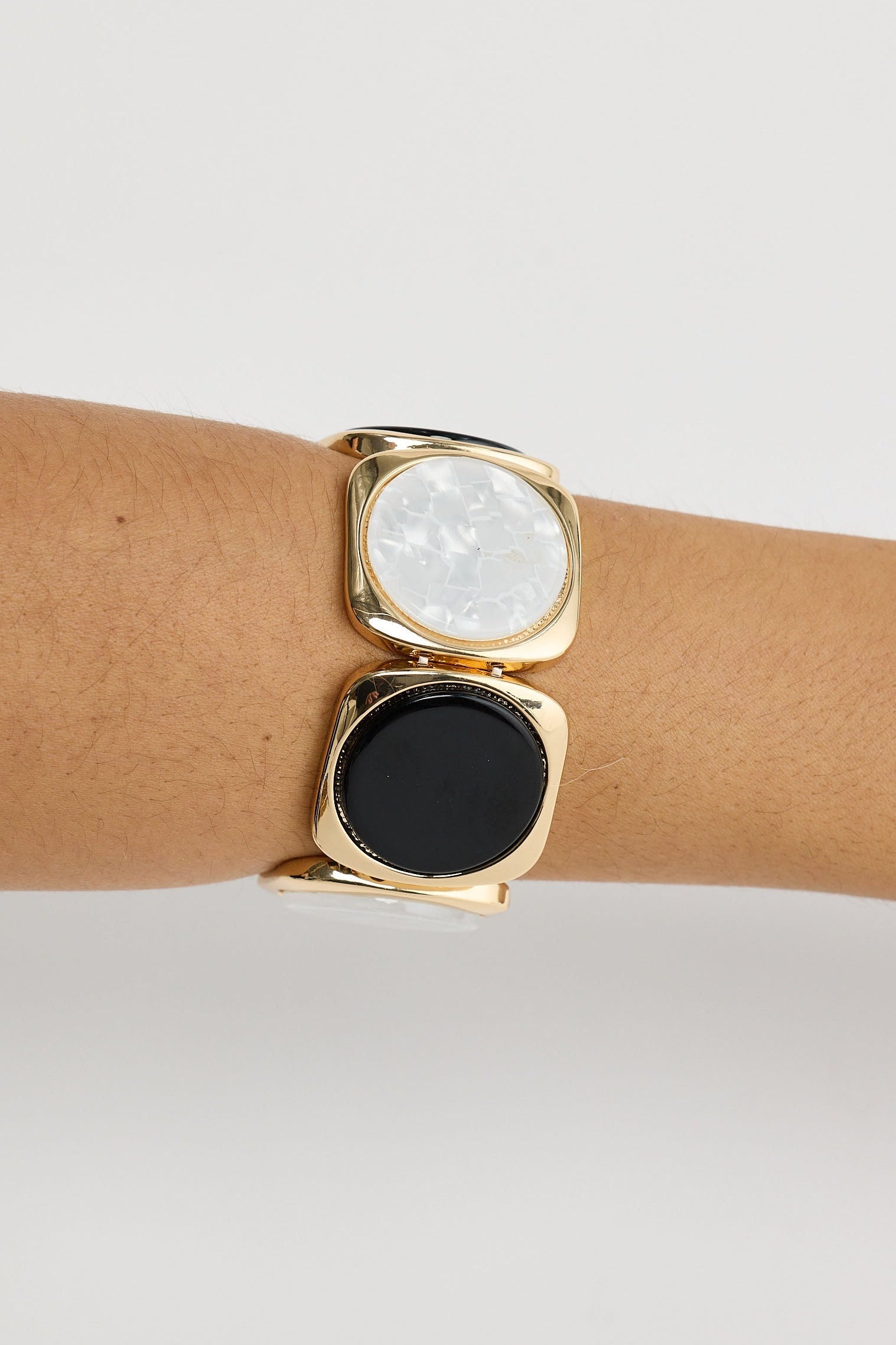 Close-up of black w white rover stretch bracelet bracelet on white background.