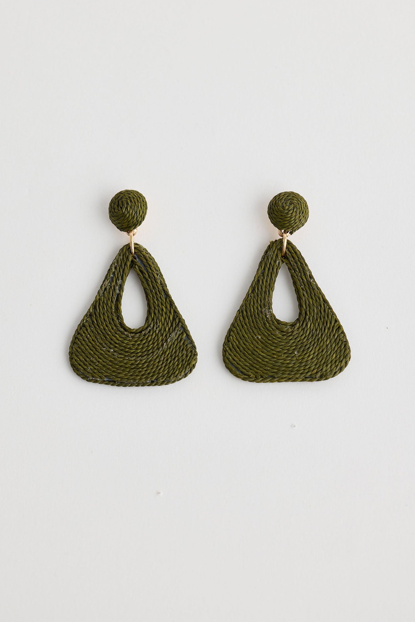 Green crochet earrings on a white background