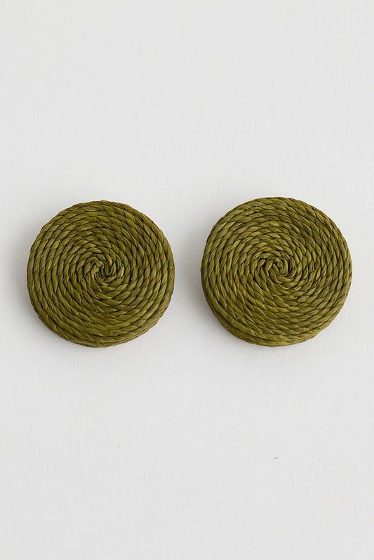 Pair of round green earrings on a white background