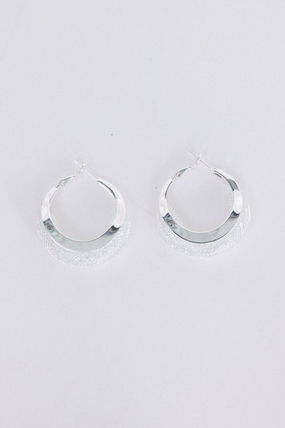 Eclipse Earrings in silver with soft textured finish, front view on white background