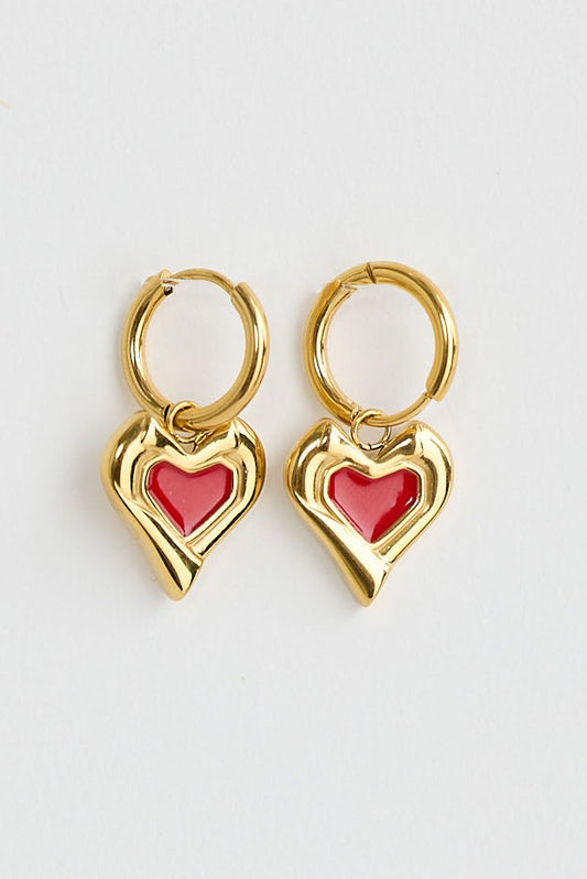 Pair of gold heart-shaped earrings on a white background