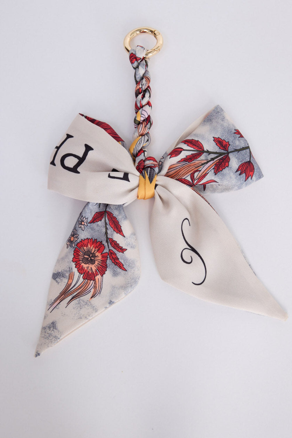 Haven Keyring in creme with printed detailing, front view on white background