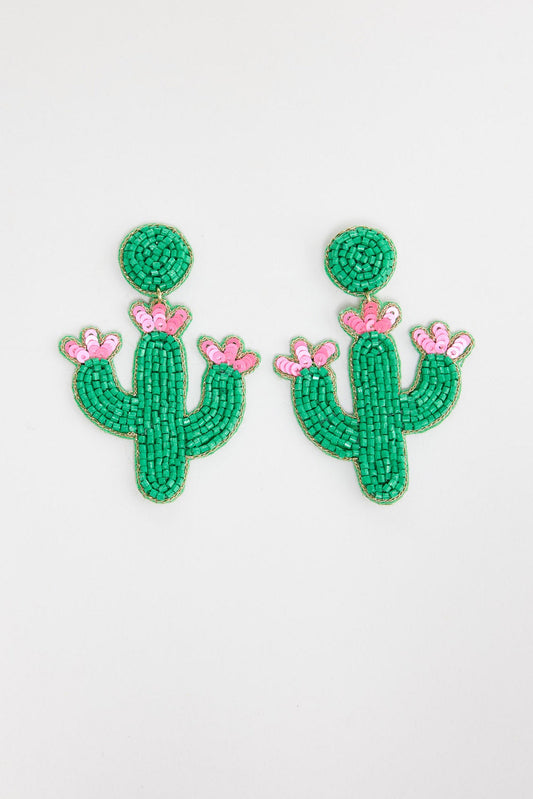Pair of large beaded cactus statement drop earrings in bright green seed beads with pink sequin flower blooms at the tips, on a round green beaded stud, laid flat on a white background