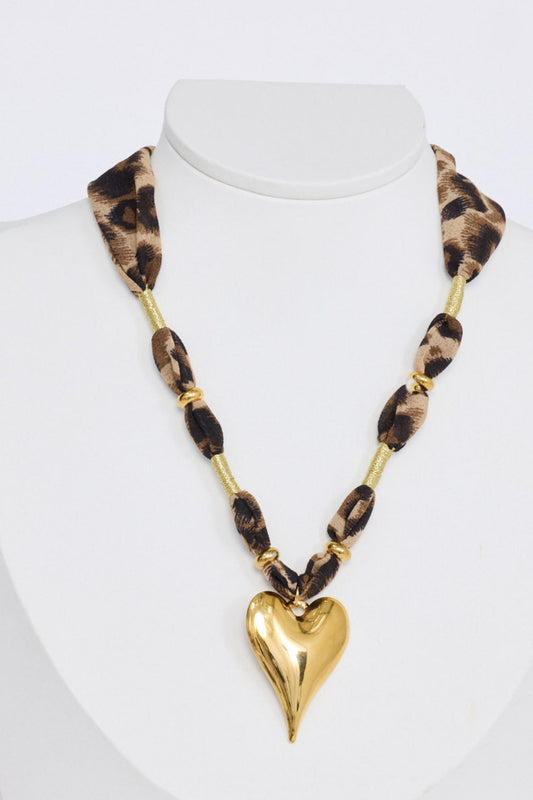 Ace Necklace in leopard with a bold heart pendant detail, side view on white background
