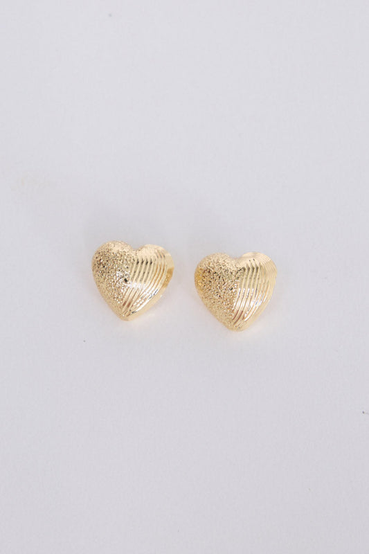 Gabby Earrings in gold with fine textured detailing, front view on white background