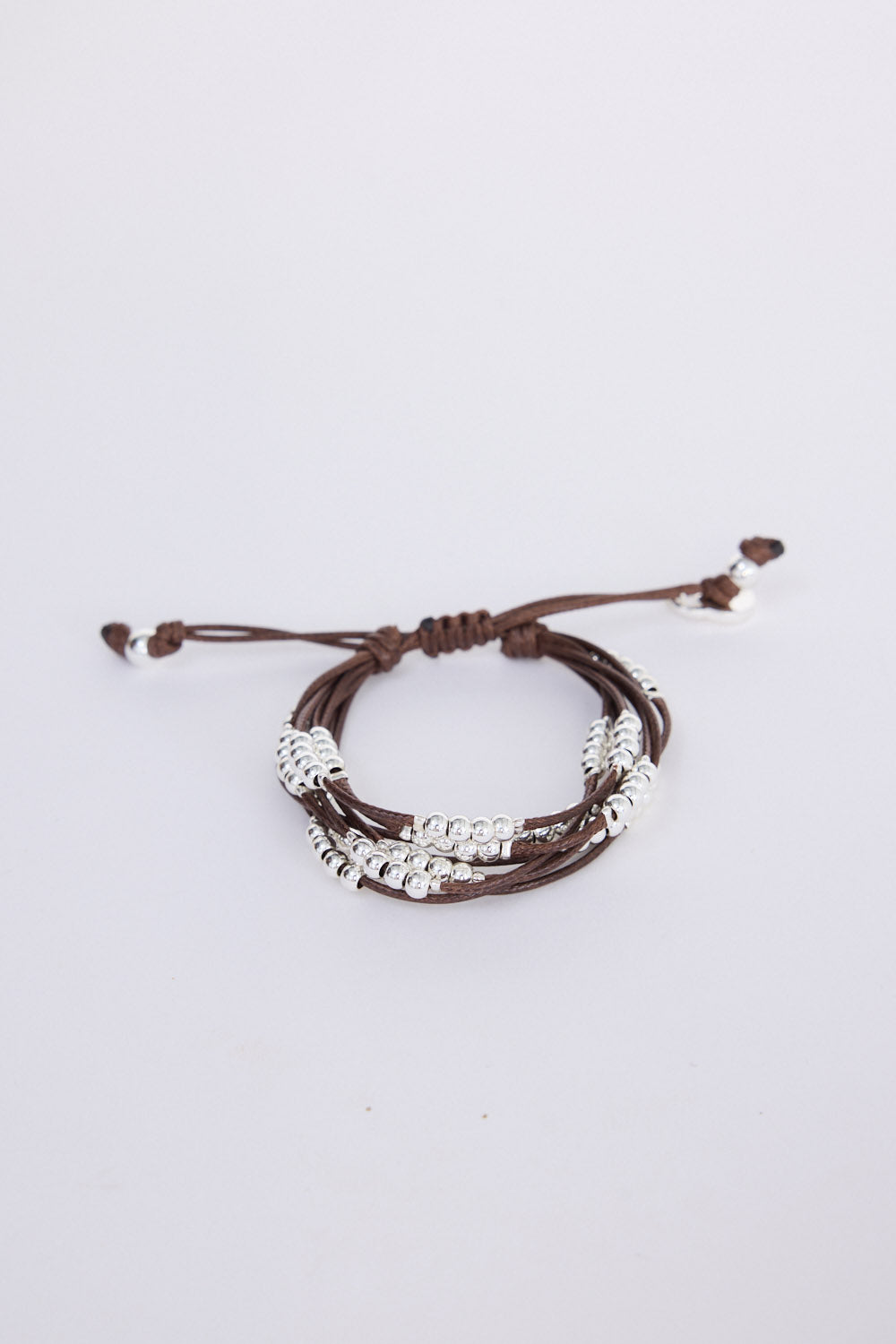 Ali Bracelet in brown with Silver with mixed bead detailing, side view on white background