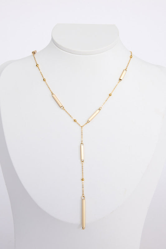 Bonita Necklace in gold with drop detailing, front view on white background