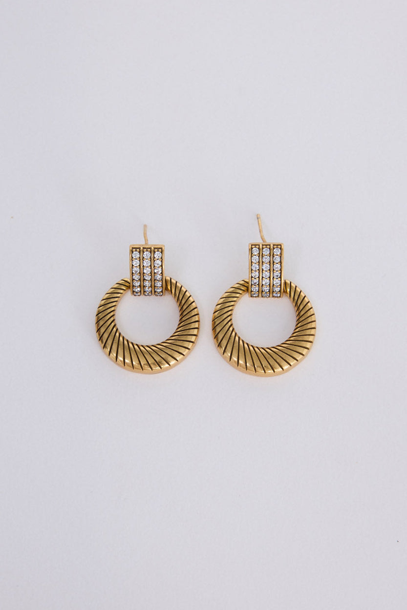 Ivy Earrings in gold with structured detailing, front view on white background