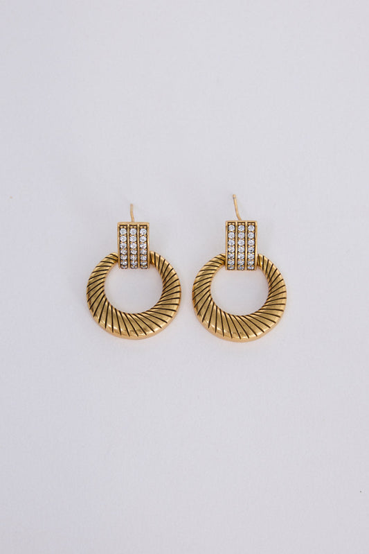 Ivy Earrings in gold with structured detailing, front view on white background