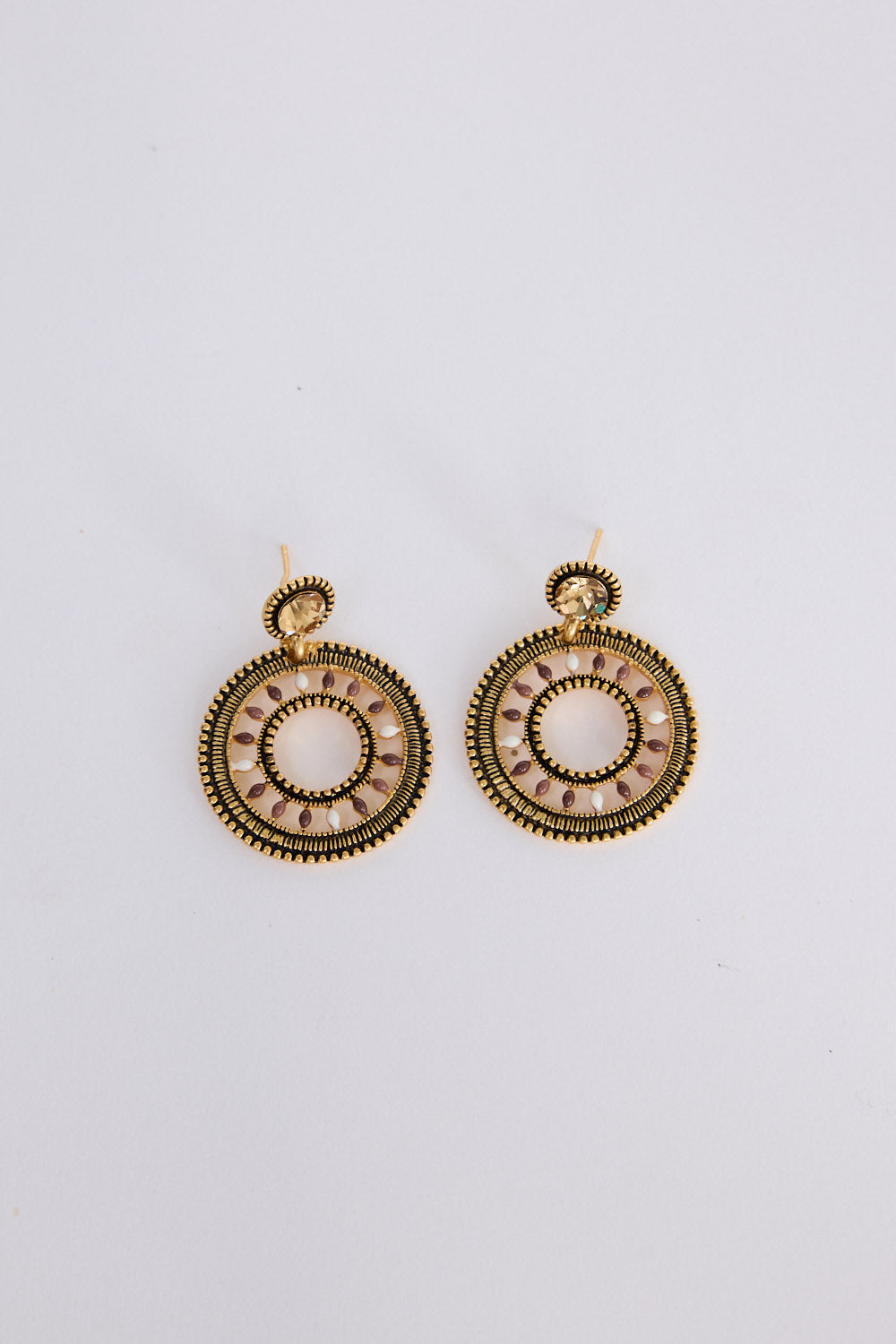 Eclipse Earrings in gold with detailed textured finish, front view on white background