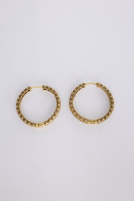 Colette Earrings in gold with subtle textured detailing, angled view on white background