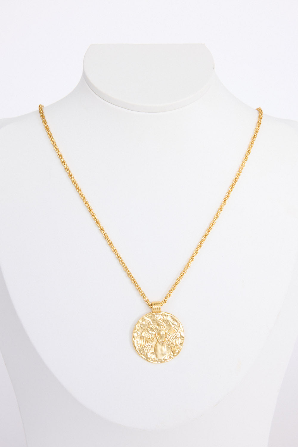 Angelic Necklace in gold with detailed coin charm, angled view on white background